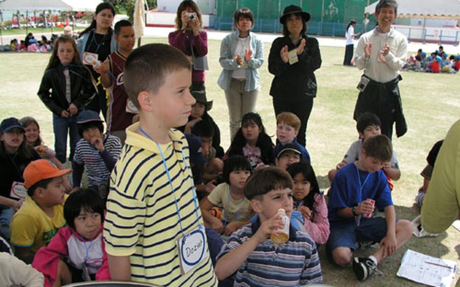Students from Kadena Elementary School recently participated in an exchange event at the Okinawa Zoo with students their age from Shimabukuro Elementary School in Okinawa City. Before saying good-bye to each other after three hours of fun time, Christopher Dozier thanked the staff and volunteers of the zoo utilizing his Japanese language ability.
